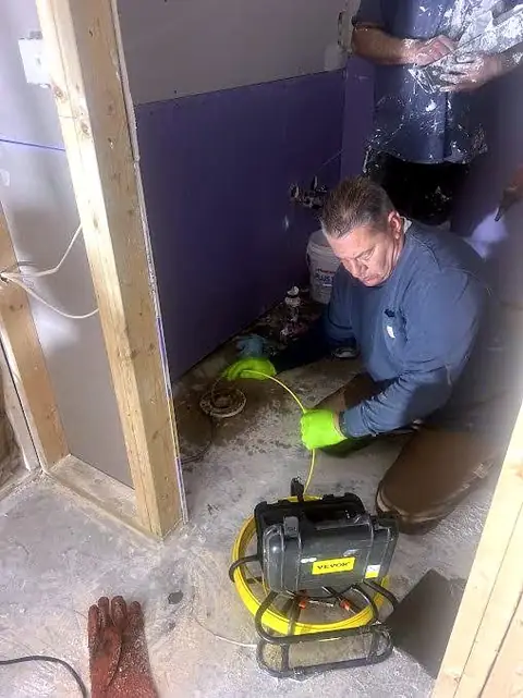 Joe running a sewer camera